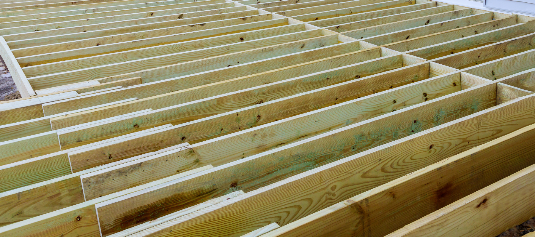 A deck being framed out and built.