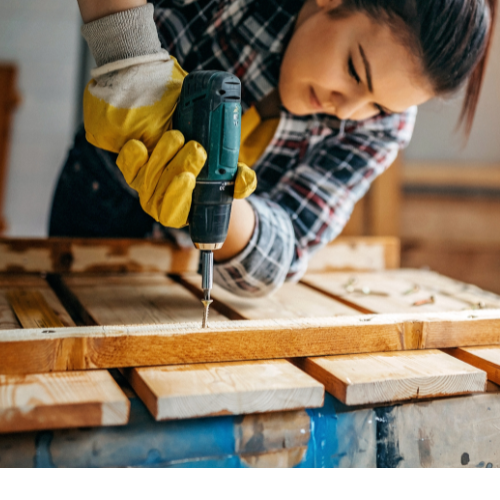 Woman using power drill